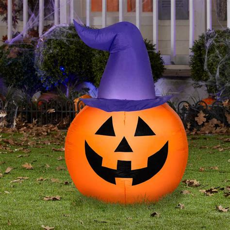 Enhance Your Halloween Decor with a Pumpkin Inflatable and Witch Hat Duo